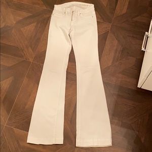 White flare leg bell bottom jeans.